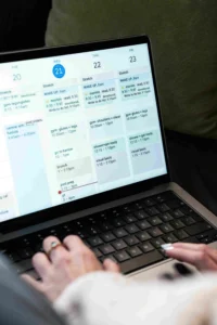 Virtual assistant working remotely on laptop performing online tasks