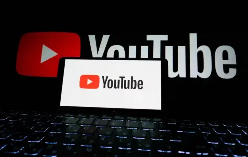 Laptop displaying the YouTube logo representing YouTube automation and online income opportunities
